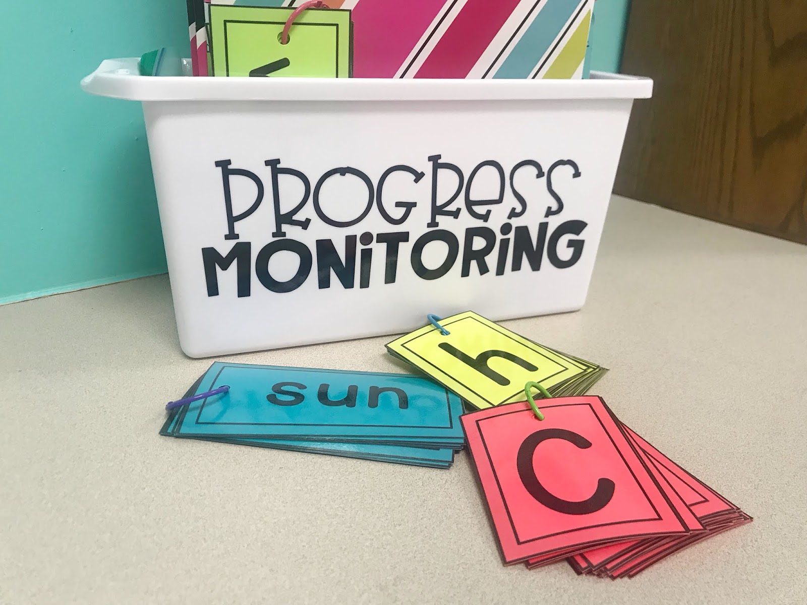 Progress Monitoring cards and tub with text "Progress Monitoring"